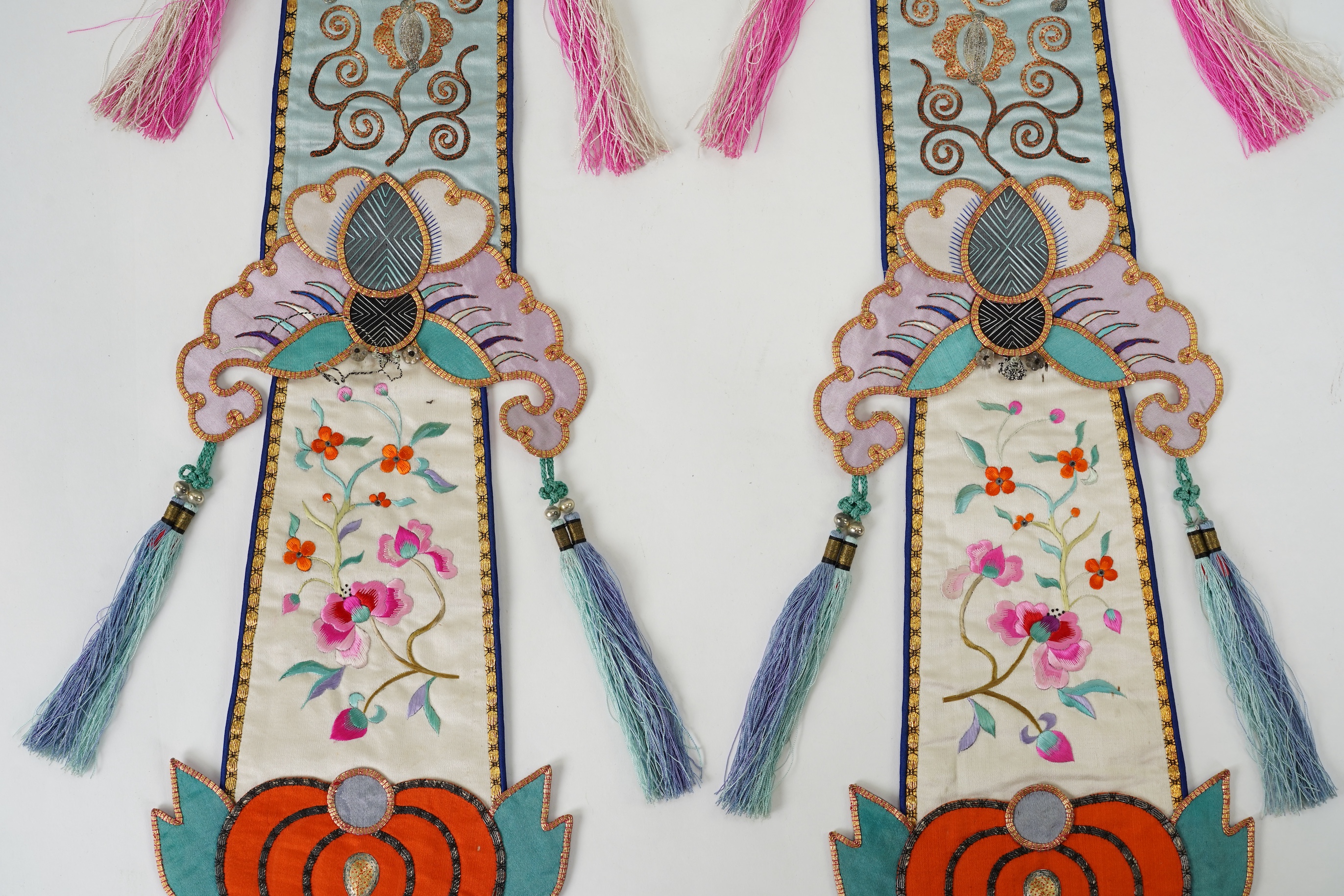 A pair of Chinese embroidered silk hanging pendants, early 20th century